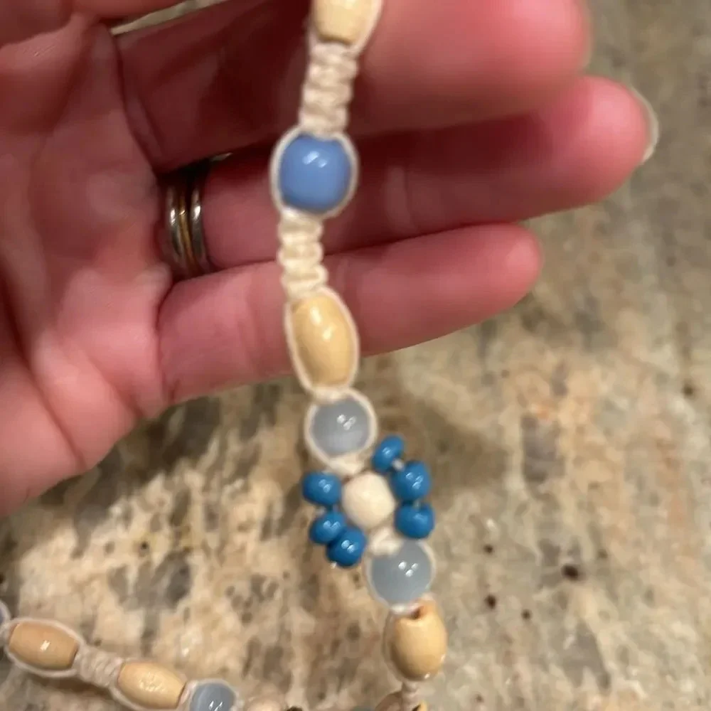 Kids beaded necklace with a silver turtle at the bottom of the necklace